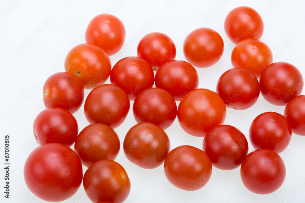 Fresh ripe cherry tomatoes isolated on a white background Fresh ripe cherry tomatoes isolated on a white background