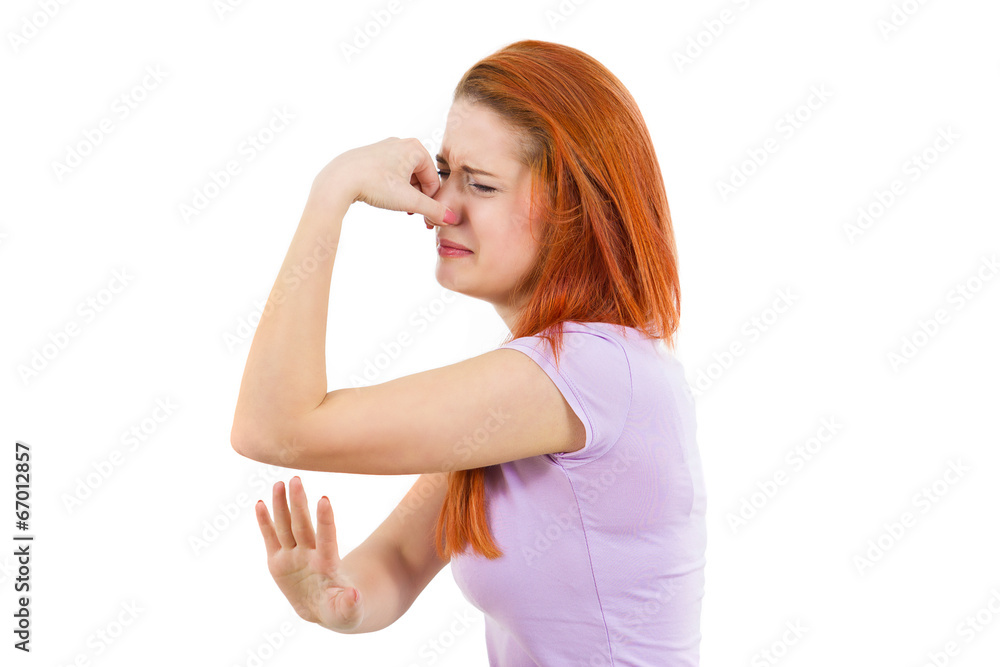 portrait unhappy woman covers her nose, bad smell portrait unhappy woman covers her nose, bad smell