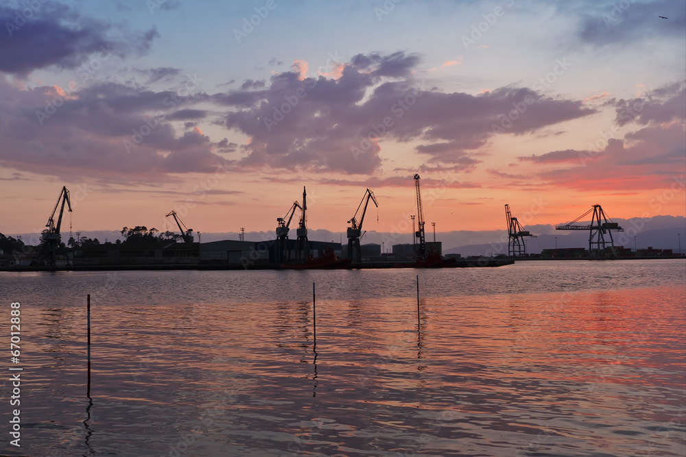 Vlagarcia harbor cranes at sunset