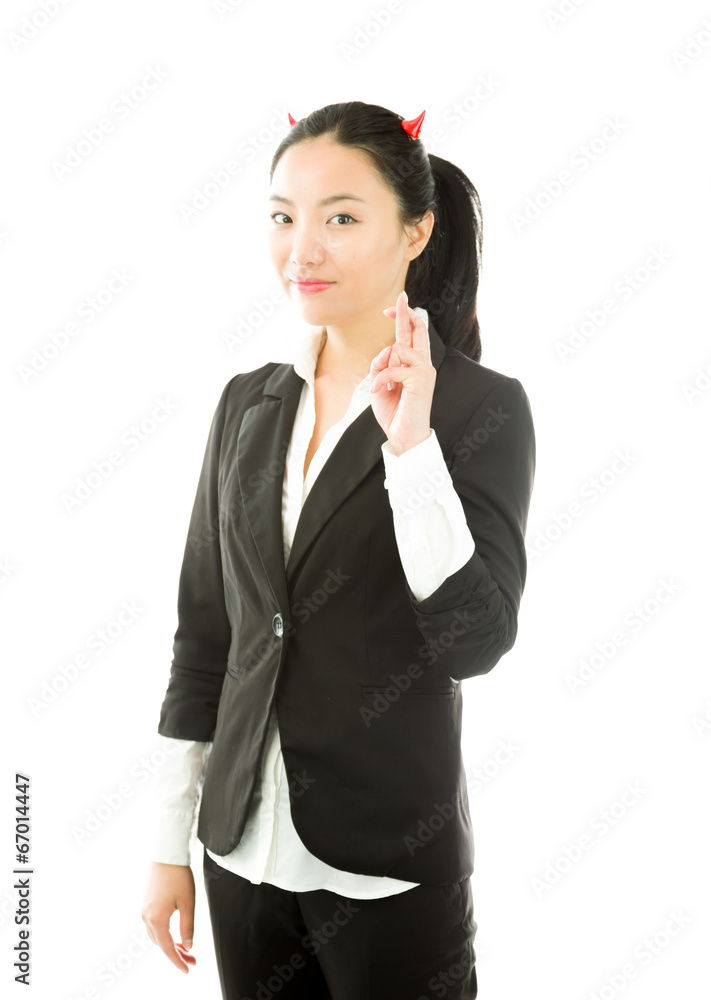 Devil side of a young Asian businesswoman standing with her Devil side of a young Asian businesswoman standing with her