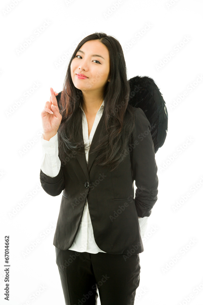 Asian young businesswoman dressed up as black angel with her Asian young businesswoman dressed up as black angel with her