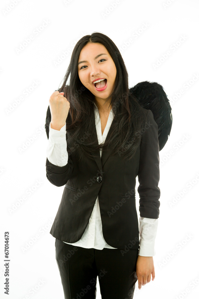 Excited Asian young businesswoman dressed up as a black angel Excited Asian young businesswoman dressed up as a black angel