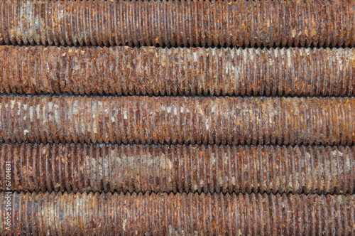 Long rusted bolts as background