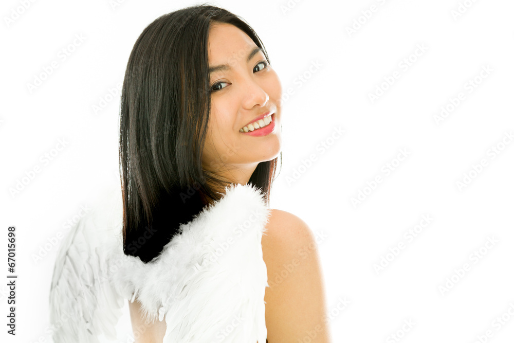 Angel side of a young Asian woman turning back and smiling Angel side of a young Asian woman turning back and smiling
