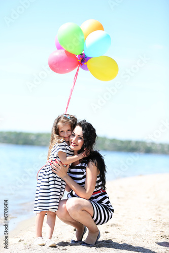 Happy mom and daughter on t...