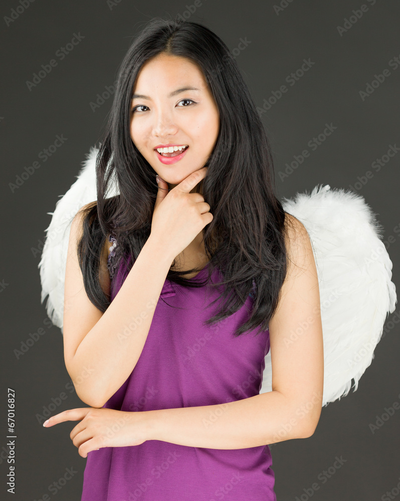 Angel side of a young Asian woman standing with hand on chin and Angel side of a young Asian woman standing with hand on chin and