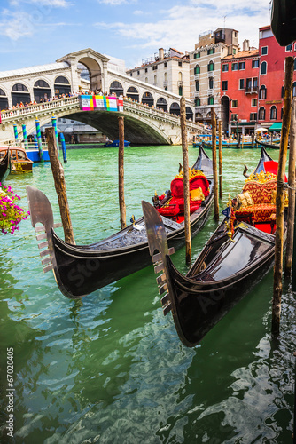 Tourists travel on gondolas at canal