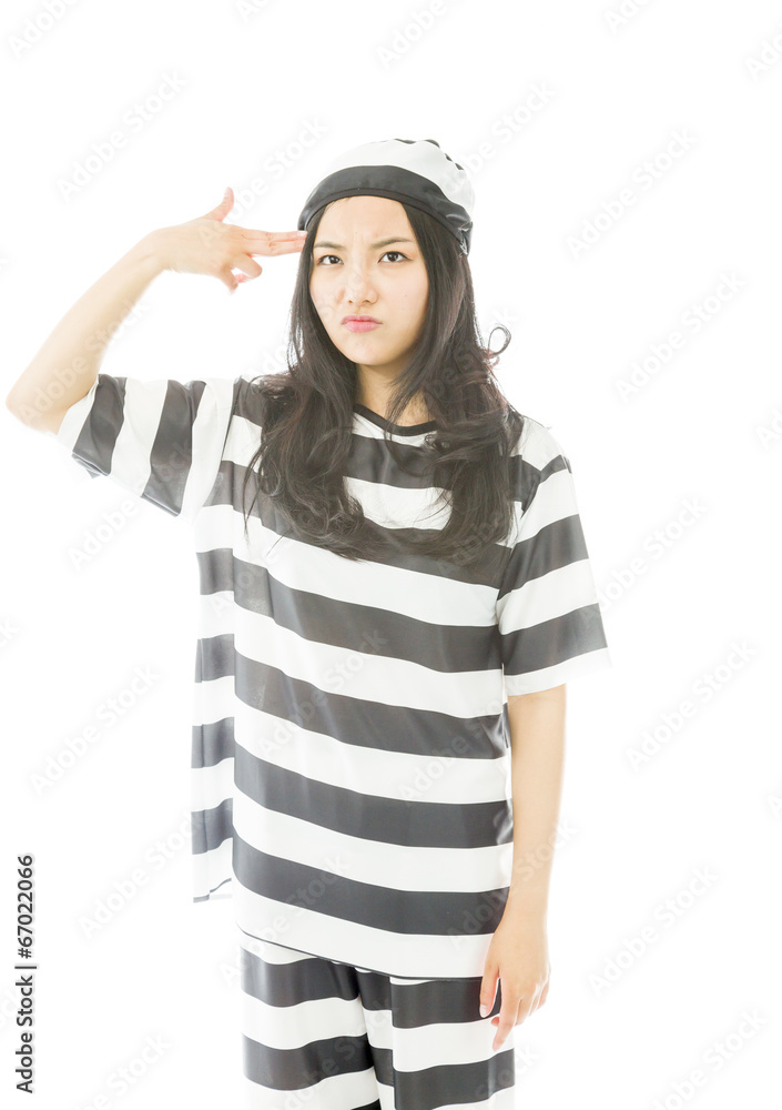 Young Asian woman shooting herself in head in prisoners uniform Young Asian woman shooting herself in head in prisoners uniform