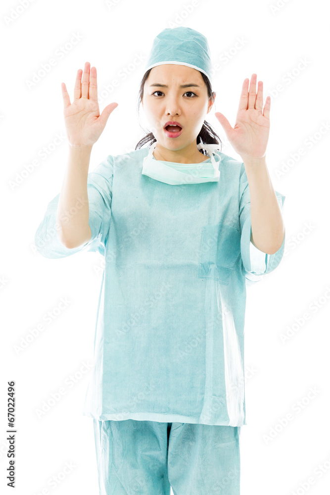 Asian female surgeon making stop gesture and showing stop Asian female surgeon making stop gesture and showing stop