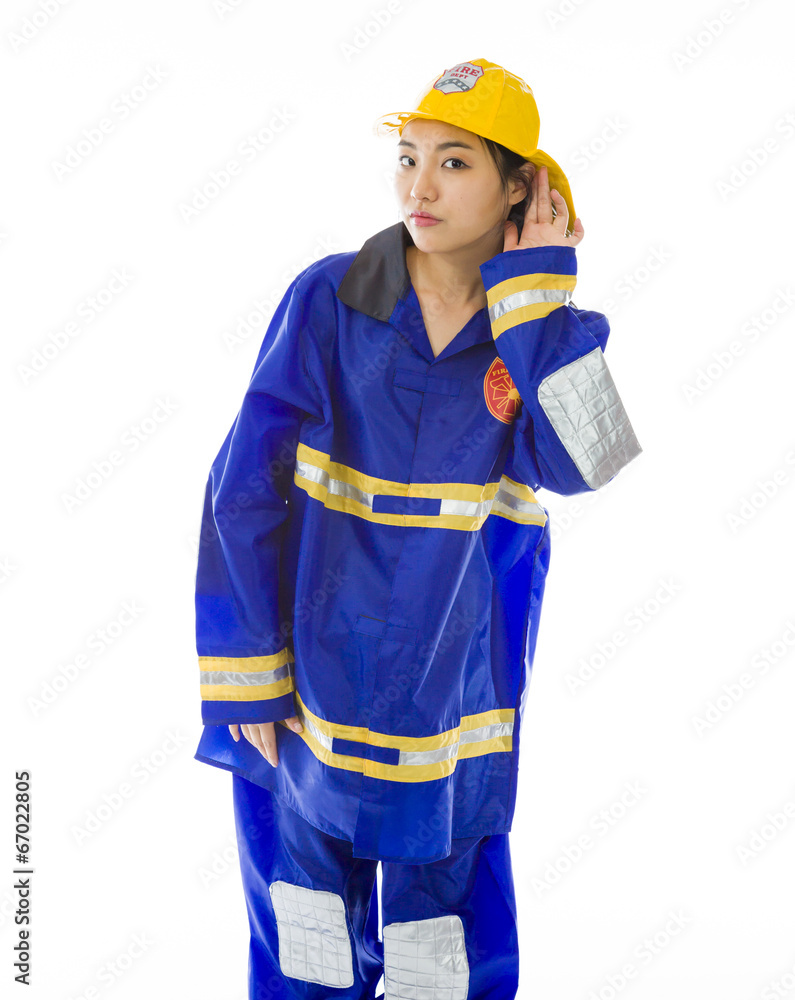 Fototapeta premium Nosy lady firefighter trying to listen carefully isolated on
