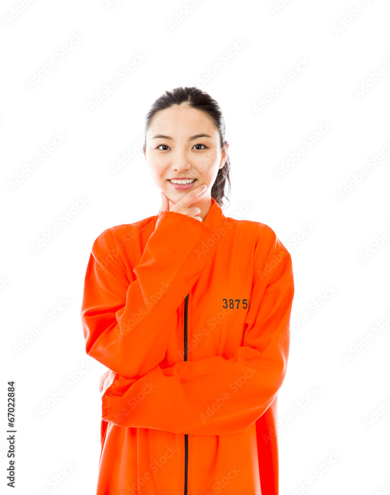 Young Asian woman smiling in prisoners uniform Young Asian woman smiling in prisoners uniform