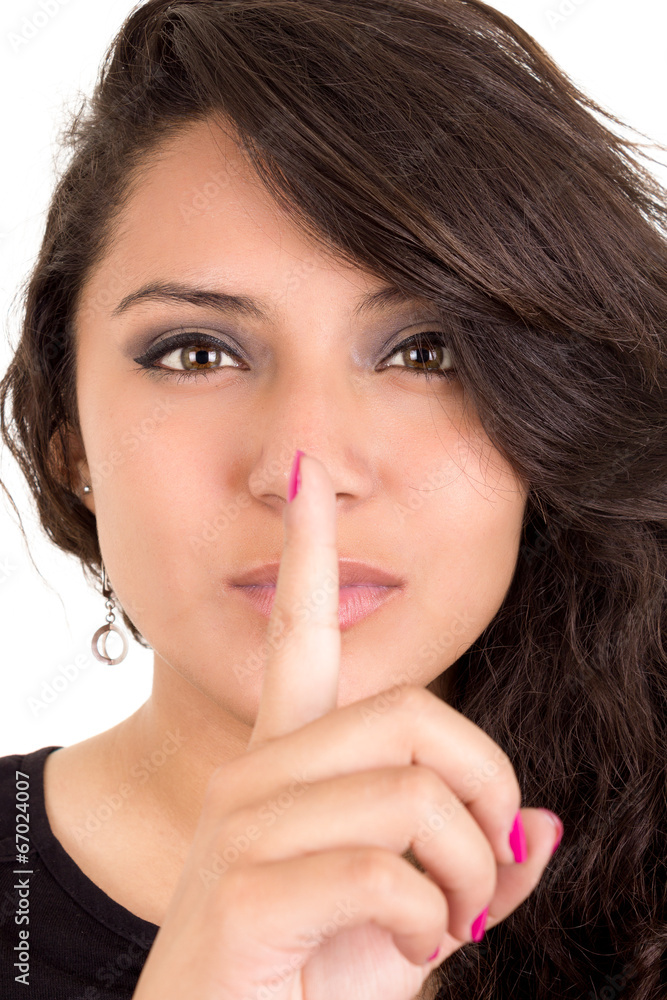 latin young girl giving the shhh expression latin young girl giving the shhh expression