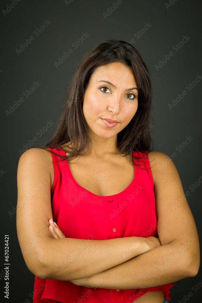 Portrait of a confident young woman with her arms crossed Portrait of a confident young woman with her arms crossed
