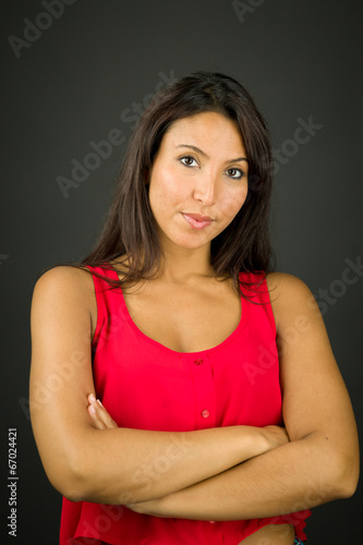 Portrait of a confident young woman with her arms crossed