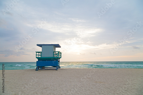 A lonely lifeguard cabin on the empty beach. © avmedved