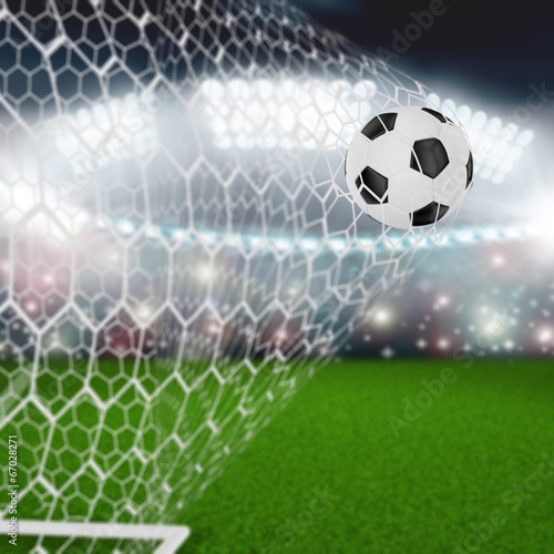 Fototapeta Naklejka Na Ścianę i Meble -  soccer ball in goal net