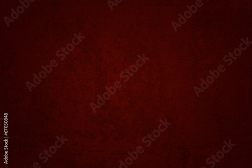 abstract red background or Christmas paper with bright center sp