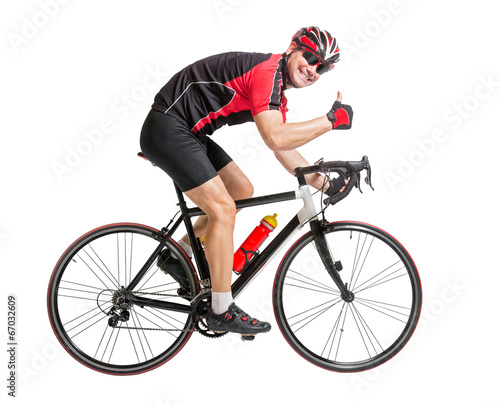 cheerful cyclist with winning gesture riding a bike