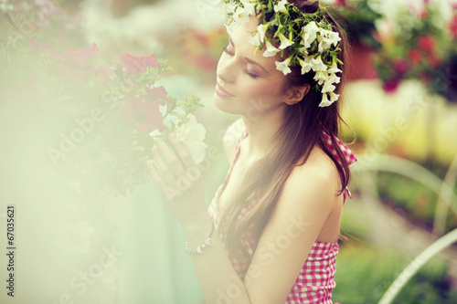 Charming girl with the flower hat