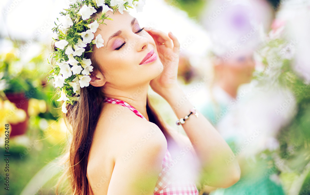 Pretty brunette lady with the colorful wreath on the head - obrazy, fototapety, plakaty 