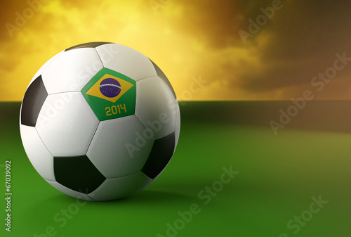 3d soccer ball with Brazil flag on green grass © Elisanth