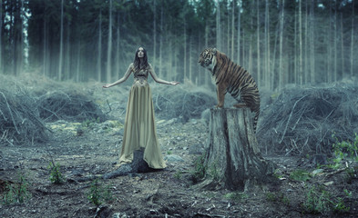 Young sexy traner with the tiger