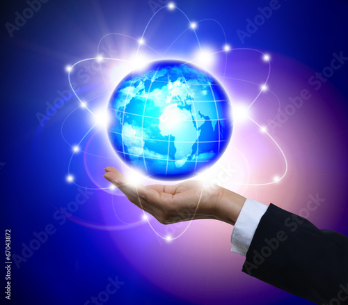 Wallpaper Mural Man holding a glowing earth globe in his hands Torontodigital.ca