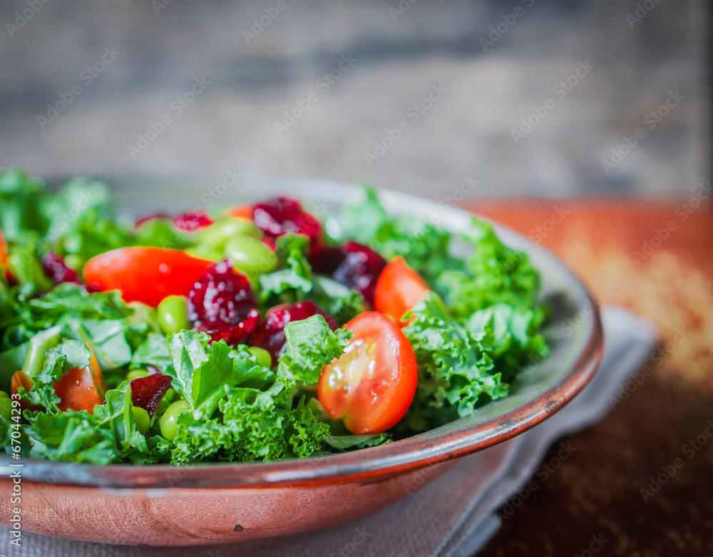 Kale and edamame salad on rustic background Kale and edamame salad on rustic background