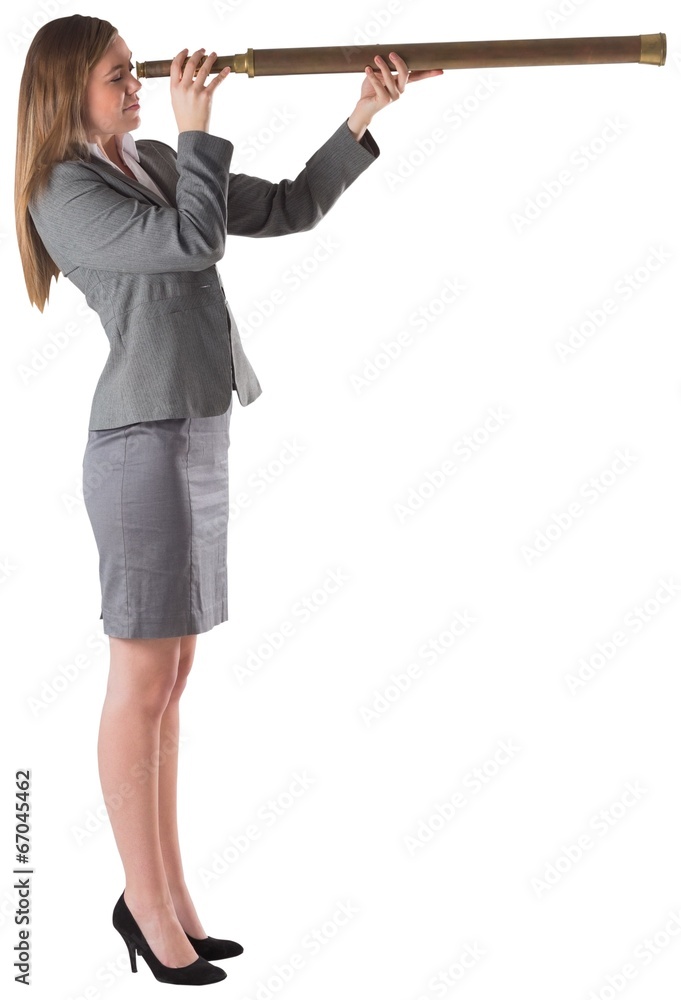Businesswoman looking through a telescope Businesswoman looking through a telescope