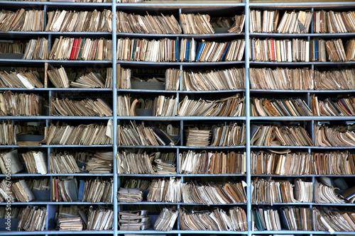 shelves full of files in an old archive photo