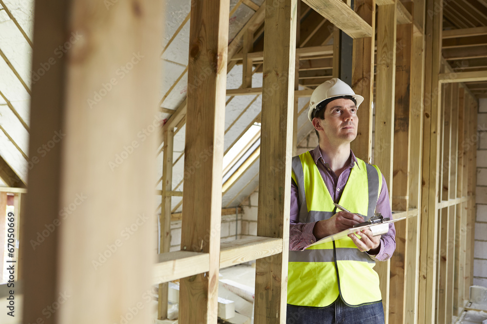 Building Inspector Looking At New Property Building Inspector Looking At New Property