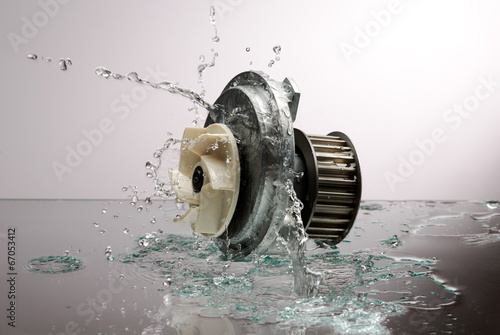 Auto parts, engine cooling pump in spurts of water.