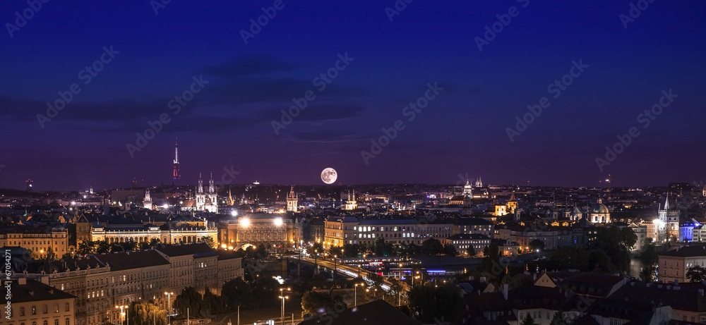 Full moon over city, Prague at night, Czech republic.