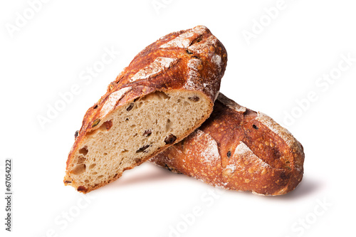 Cereal bread with raisins isolated on white background © zakiroff