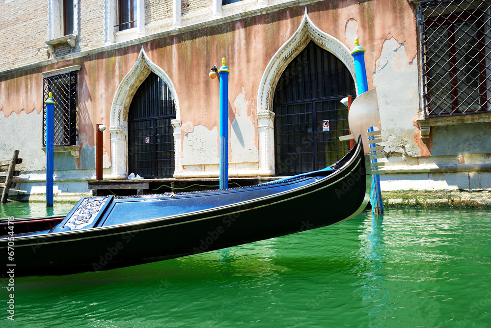 The gondola is on water channel, Venice, Italy