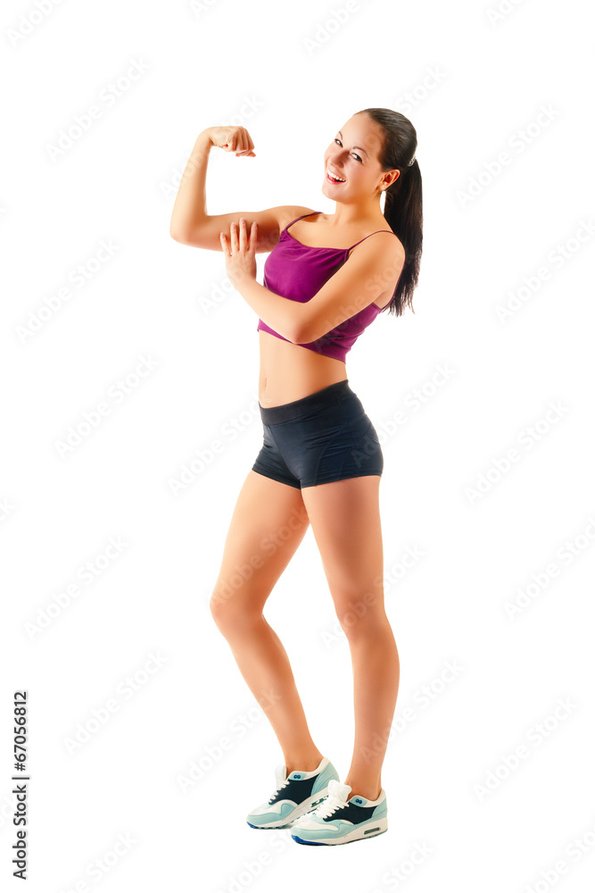 young sportswoman in sportswear showing muscles young sportswoman in sportswear showing muscles