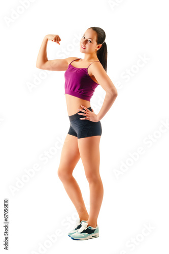 young women in sportswear showing muscles