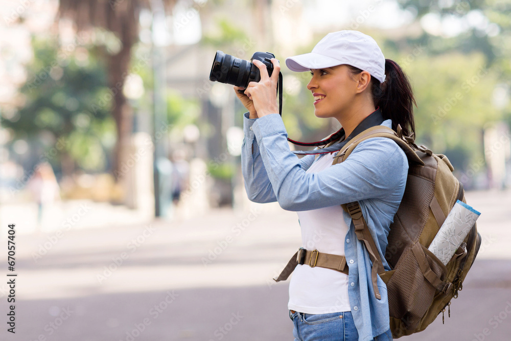 young female tourist taking pictures