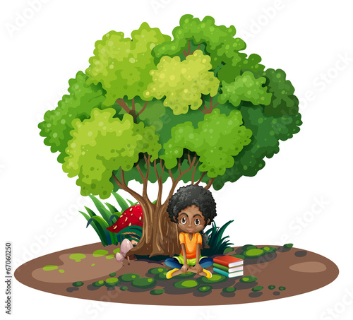A young girl under the tree beside her books