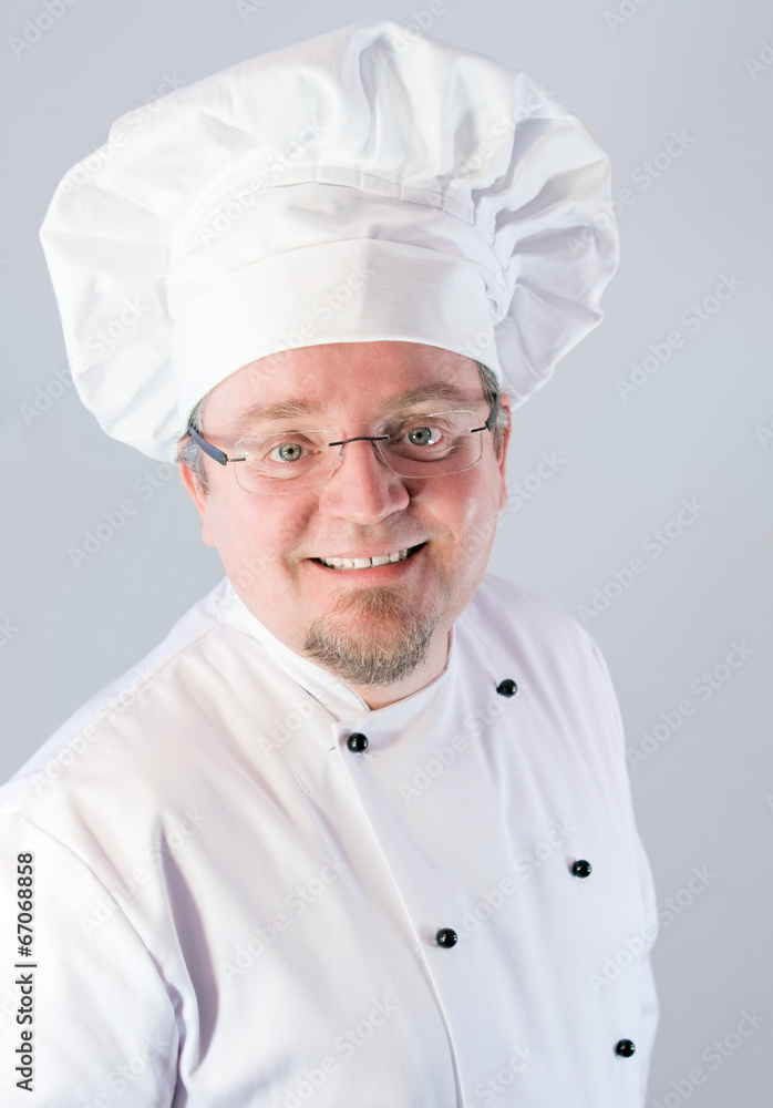 Smiling cook chef on white