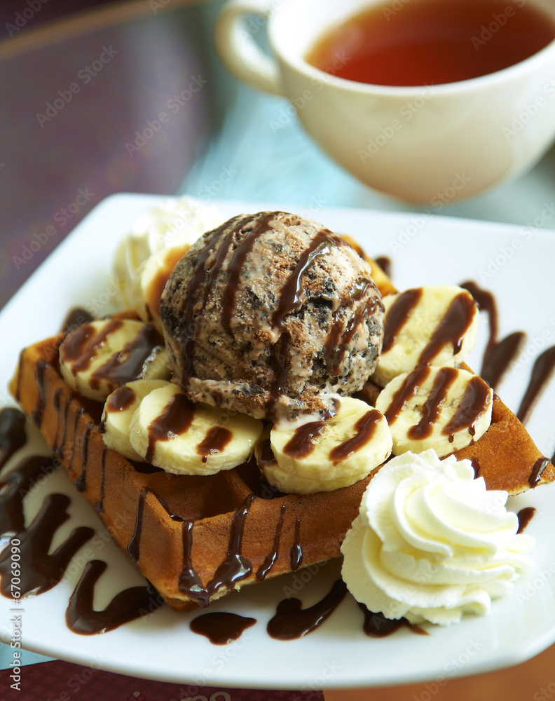 close up chocolate waffle and banana with sweet sauce close up chocolate waffle and banana with sweet sauce