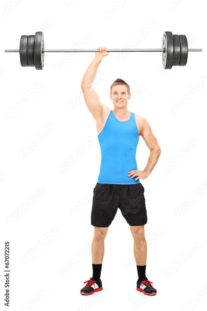 Strong guy holding a barbell in one hand Strong guy holding a barbell in one hand