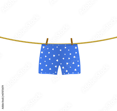 Boxer shorts with white hearts hanging on rope