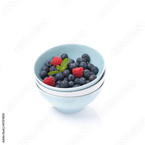 different bowls clean and fresh berries, isolated