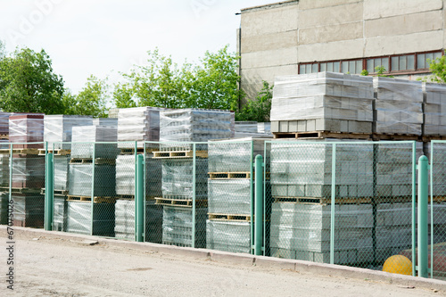 Packed cinder blocks outdoors in racks