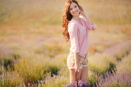 Beautiful girl on the lavender field.