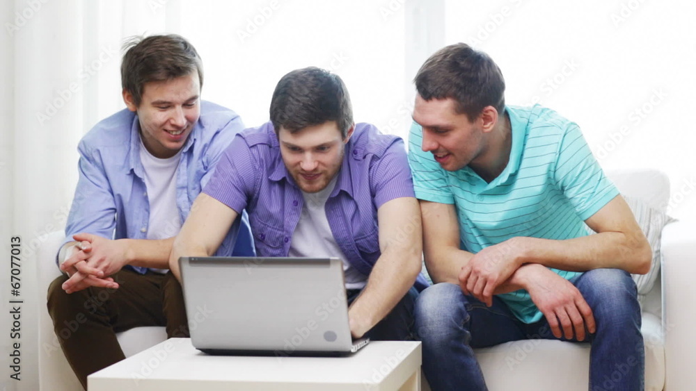 smiling friends with laptop computer at home smiling friends with laptop computer at home