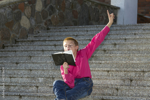 Boy likes to read literature