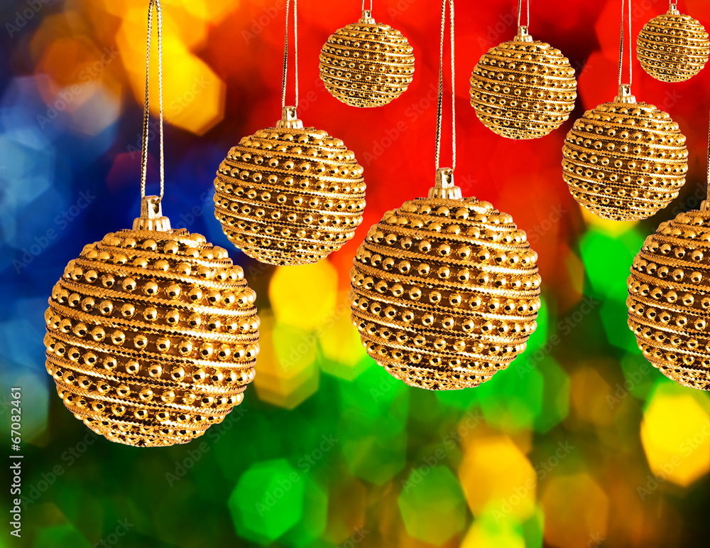 Obraz premium Golden Christmas balls with blur shiny background