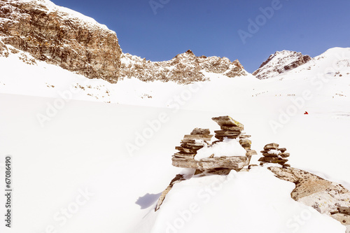 Pyramid build from stones on a mountain slope photo